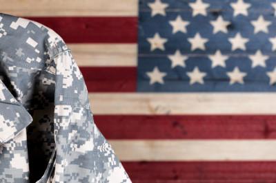 Soldier in front of American Flag